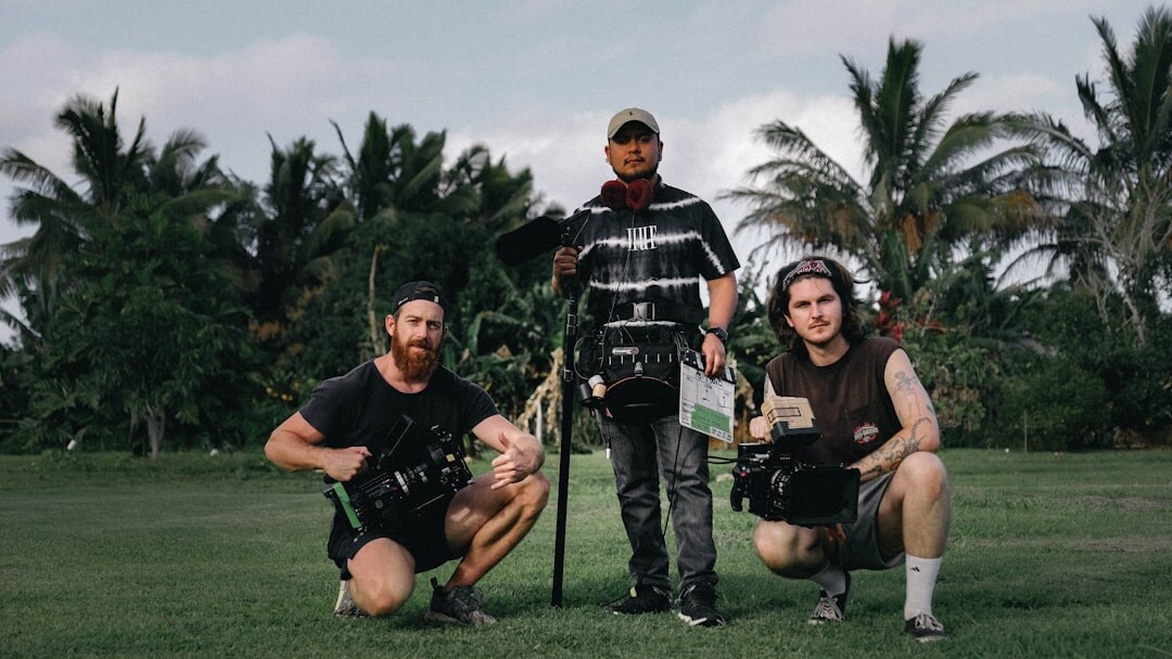 Group photo of a video production team with camera equipment