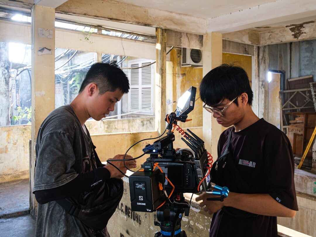 Small production team reviewing a shot list before filming
