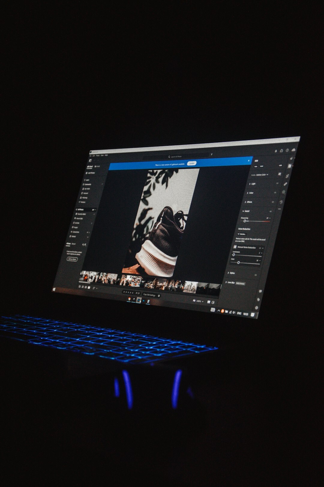 Editor cutting a short vertical video clip on a laptop