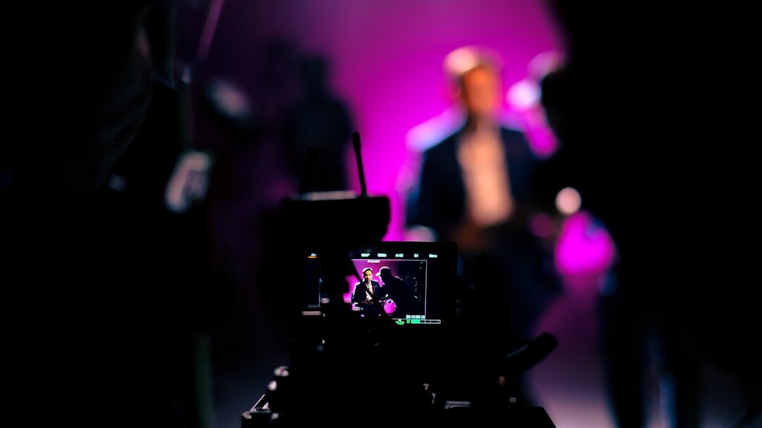 Close up of a professional video camera filming a live performance